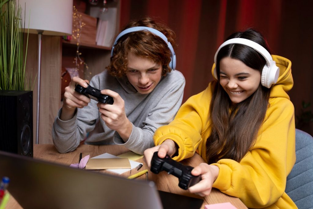 Two teenage friends are playing in online gaming platform